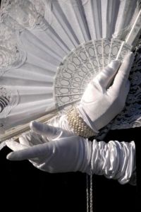 white gloves and fan